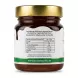 A clean, studio photograph of the back label of Honeyman UK Organic Forest Honey, showing ingredients and detailed nutritional information for 100g, including energy, fats, carbohydrates, and protein, against a pure white background. The jar is centered, featuring a gold lid and a green-banded label.