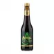 Hand holding a bottle of Aspall Apple Balsamic Vinegar in a shop aisle