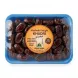 Hand holding a pack of Madinah Delight Khudri Dates 450g with special offer label